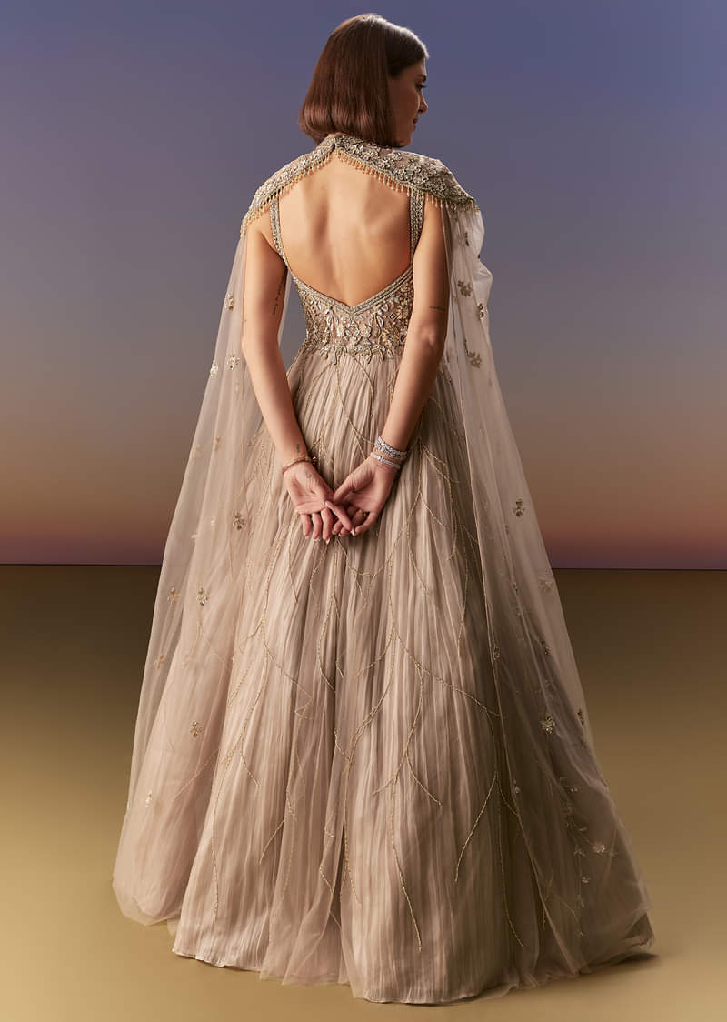 Beige Gown With Shoulder Cape And Rich Vertical Embroidery - Image 2