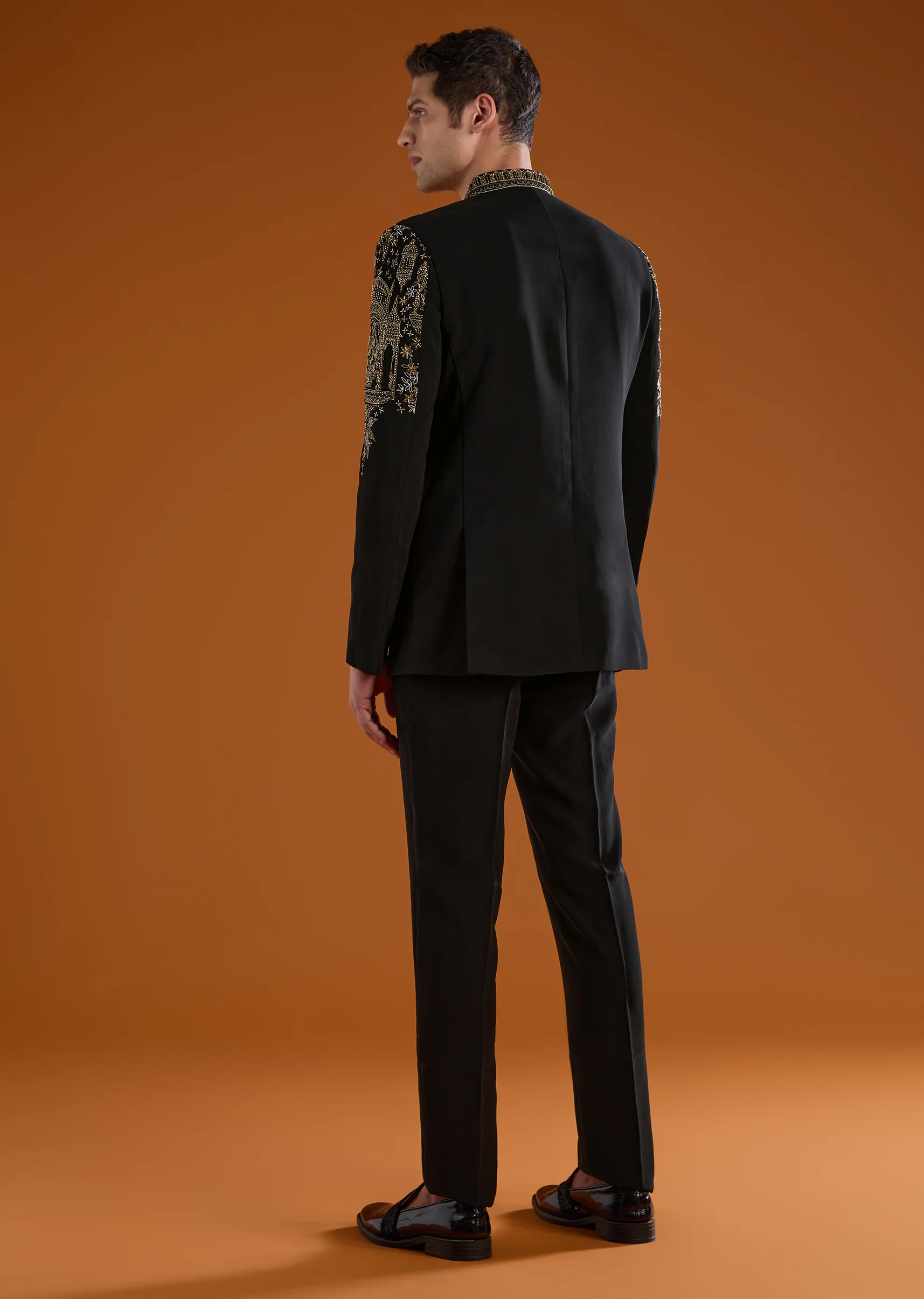 Bold Festive Couple Set – Black Silk Palazzo Suit With Zari Thread And Sequins Work For Her And Black Suiting Jodhpuri Pant Set With Embroidery For Him - Image 9