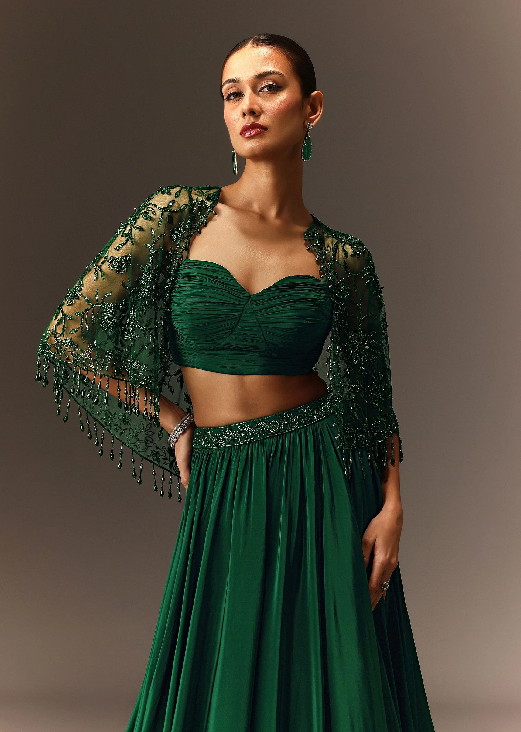 Bottle Green Tiered Lehenga With Net Cape - Image 2