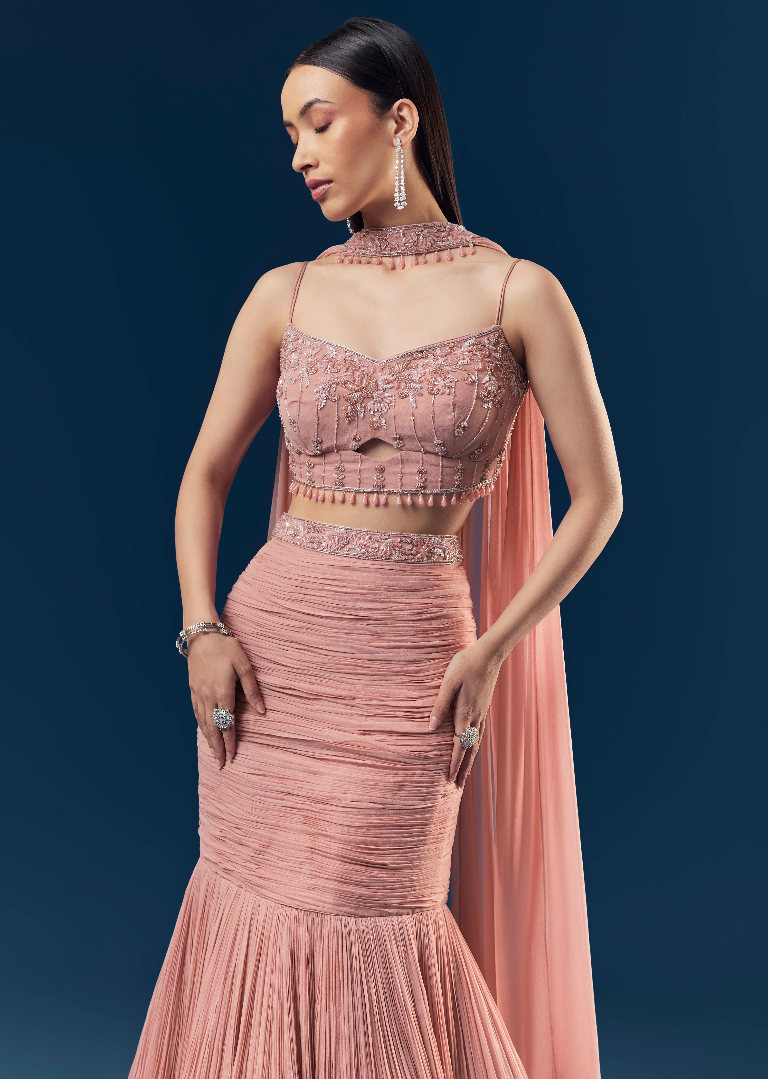 Celebration Couple Set – Blush Pink Georgette Fish-Cut Lehenga with Embroidered Sleeveless Blouse & Choker Dupatta for Her And Pink Jodhpuri-Style Tuxedo Set with Metal Broach for Him - Image 4