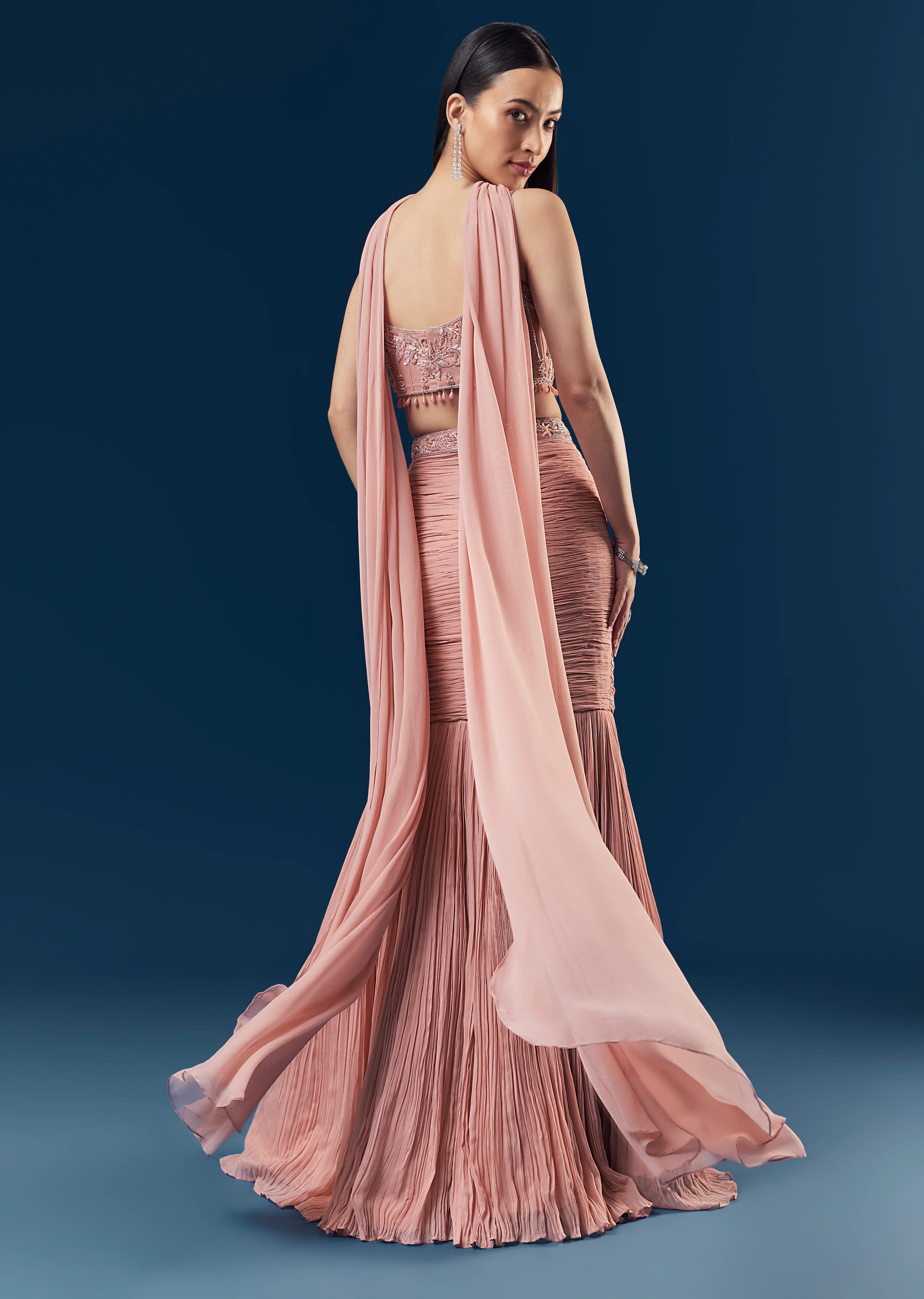 Celebration Couple Set – Blush Pink Georgette Fish-Cut Lehenga with Embroidered Sleeveless Blouse & Choker Dupatta for Her And Pink Jodhpuri-Style Tuxedo Set with Metal Broach for Him - Image 5