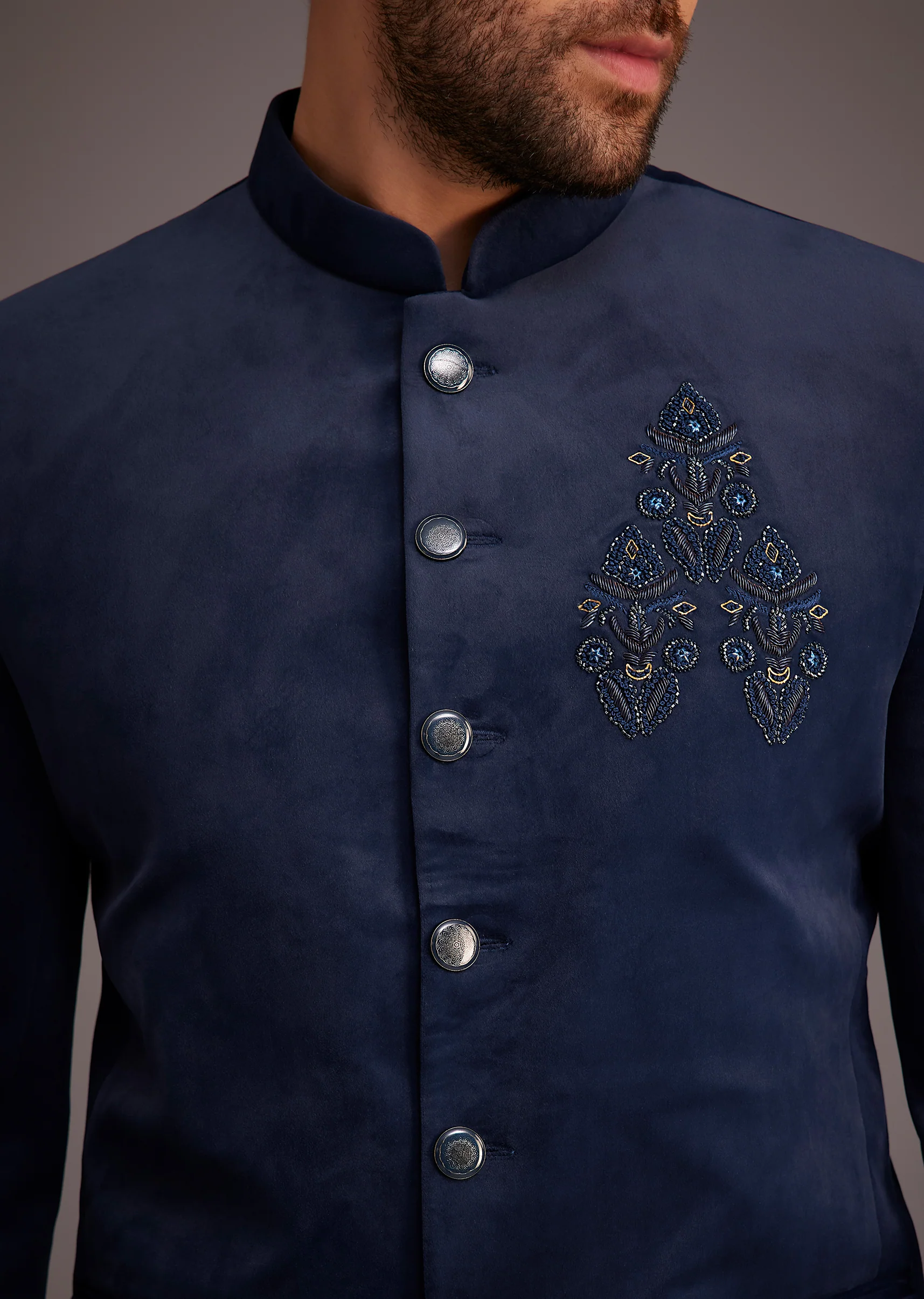 Contemporary Reception Couple Set – Navy Indo-Western Draped Skirt Set with Embroidered Jacket for Her And Blue Embroidered Bandhgala for Him - Image 8