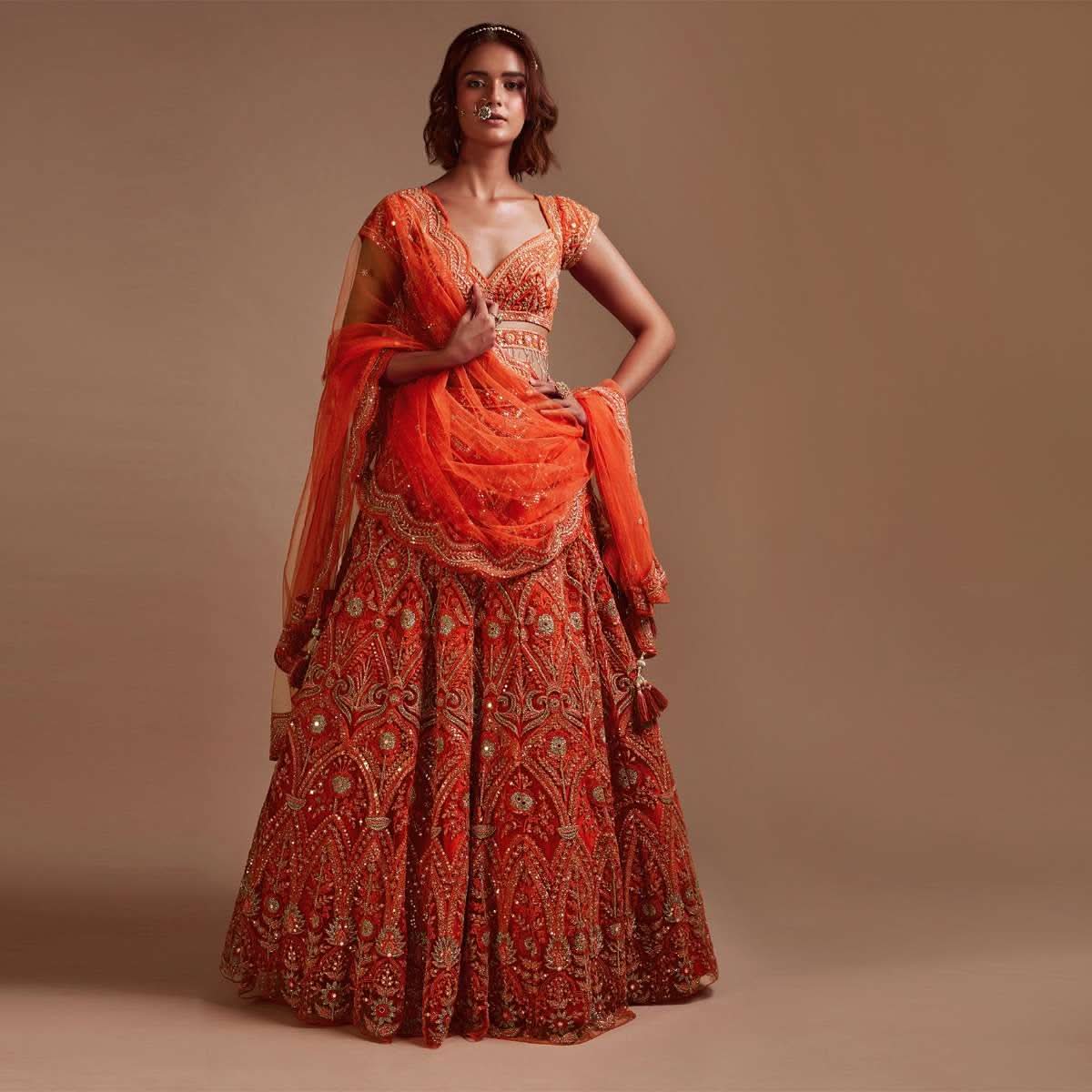 Coral Orange Lehenga Choli In Net With Mirror And Sequins Embroidered Floral And Mughal Embroidery Along With Belt Detailing - Image 2