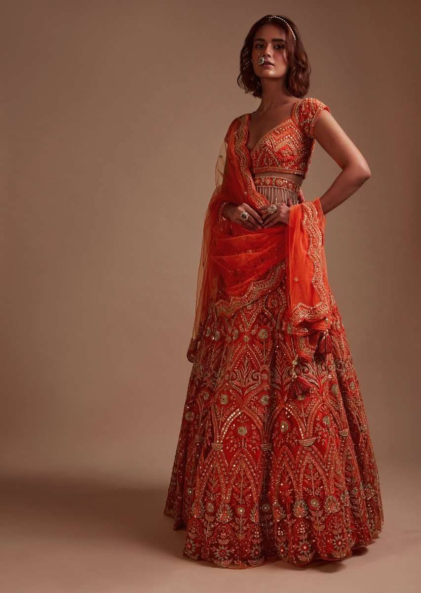 Coral Orange Lehenga Choli In Net With Mirror And Sequins Embroidered Floral And Mughal Embroidery Along With Belt Detailing - Image 3