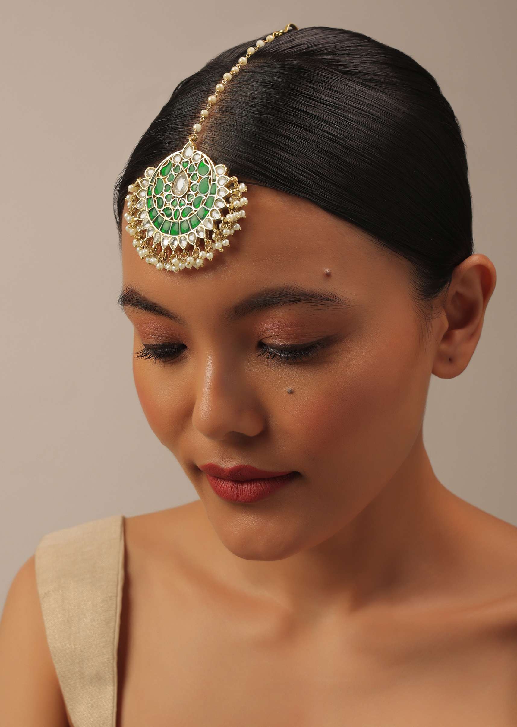 Gold Finish Kundan Maangteeka With Synthetic Emerald Stones And Beads