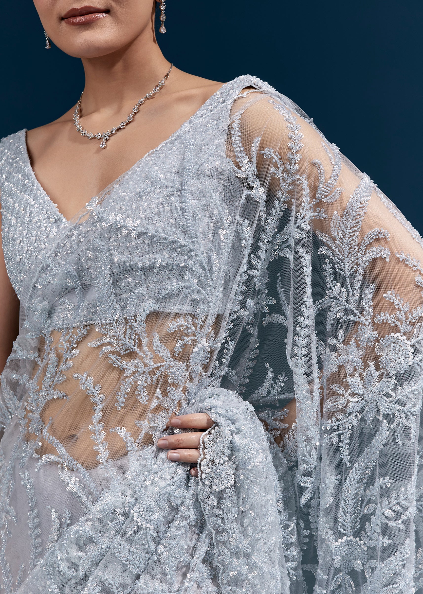 Ice Blue Heavy Embroidered Net Saree With Cutwork Border And All Over Floral Jaal - Image 2