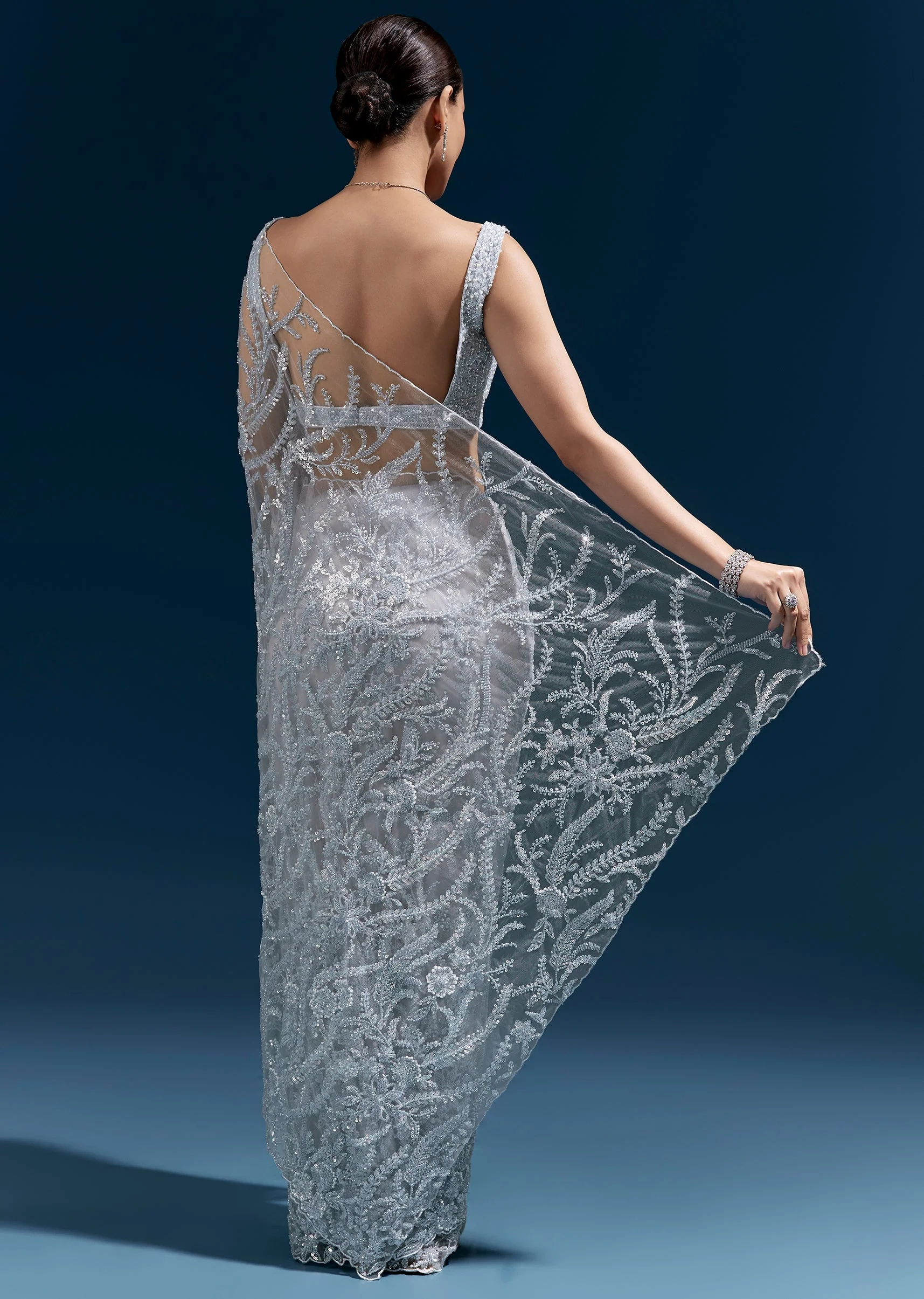 Ice Blue Heavy Embroidered Net Saree With Cutwork Border And All Over Floral Jaal - Image 4