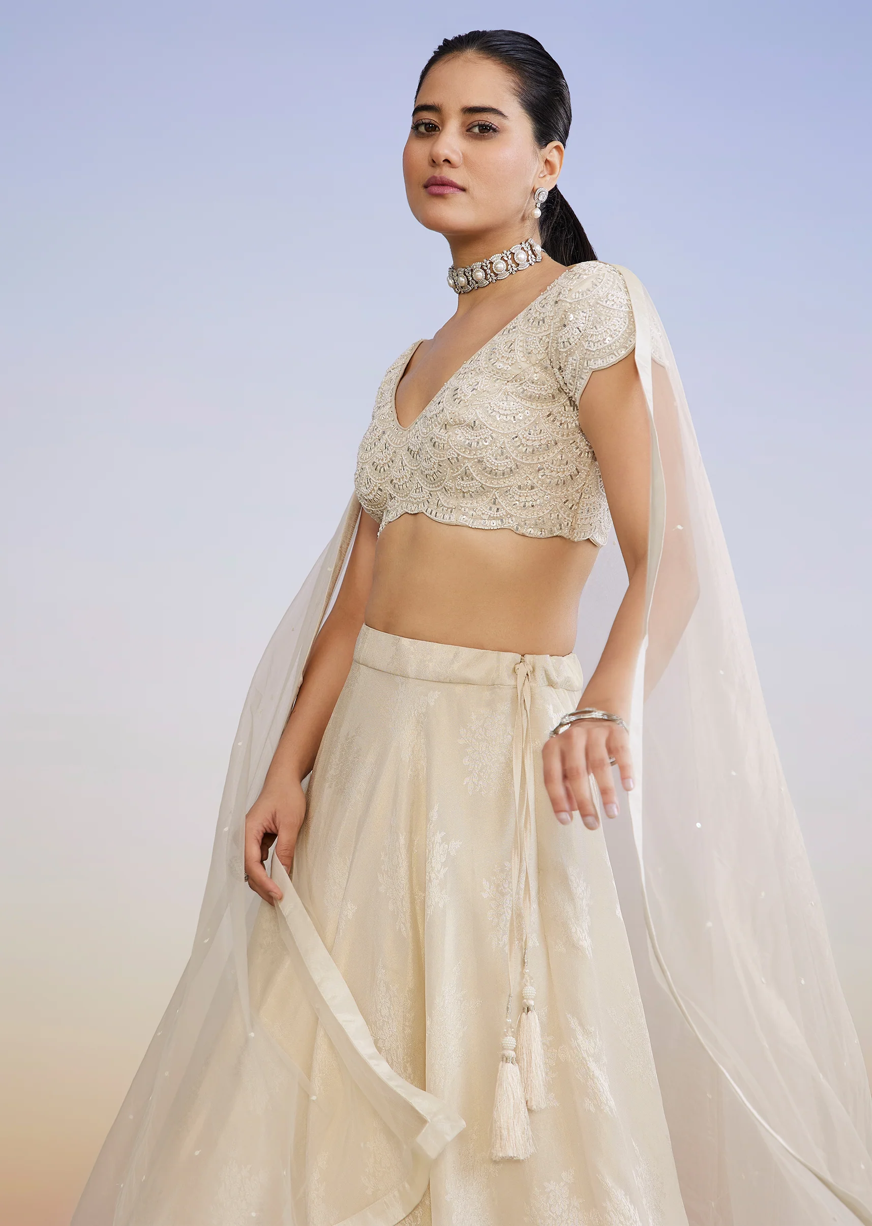 Ivory Regal Duo – Embroidered Lehenga For Her And Jacquard Jodhpuri Suit For Him - Image 3