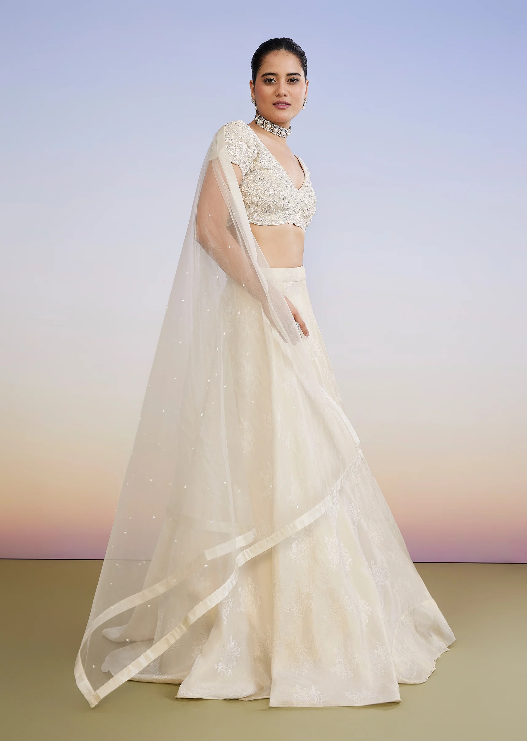 Ivory Regal Duo – Embroidered Lehenga For Her And Jacquard Jodhpuri Suit For Him - Image 4