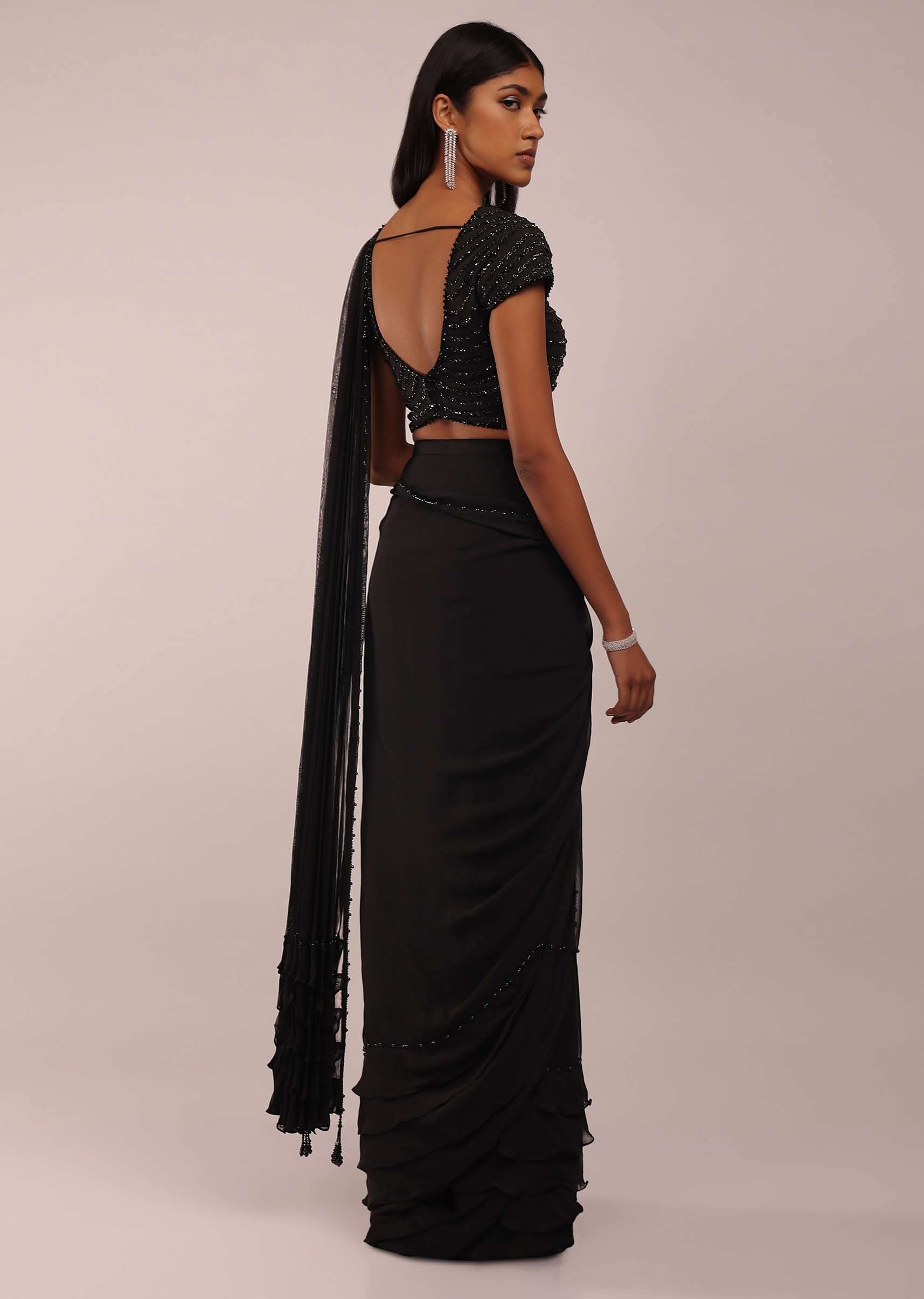 Pitch Black Saree With Three Tones Of Layered Frills On The Bottom Embellished In Stones And Sequins With A Tassel On The Pallu Corner - Image 5