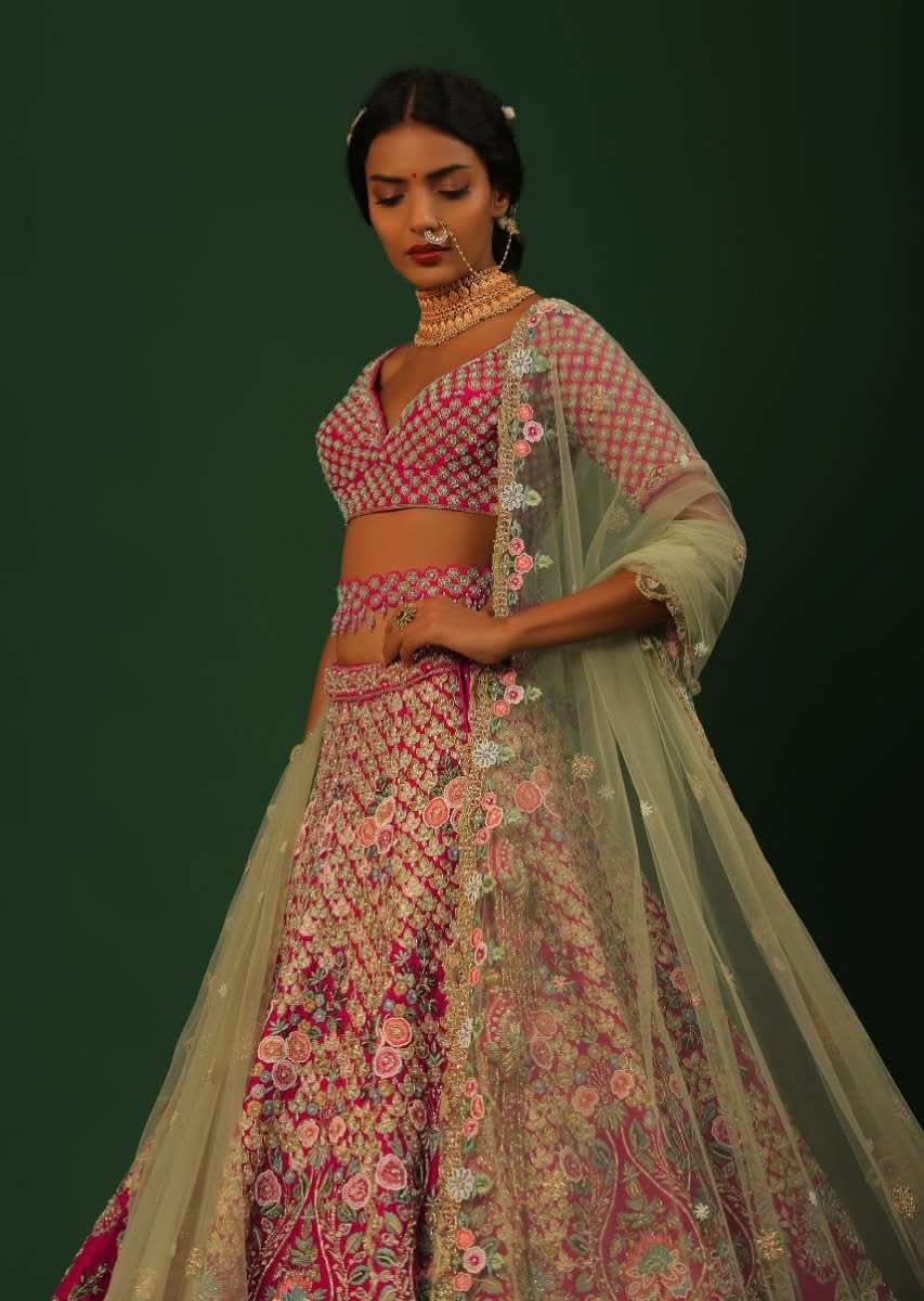 Rani Pink Lehenga Choli In Raw Silk With Heavy Embroidered Kalis Using Colorful Resham And Cut Dana In Floral Motifs Online - Kalki Fashion - Image 2