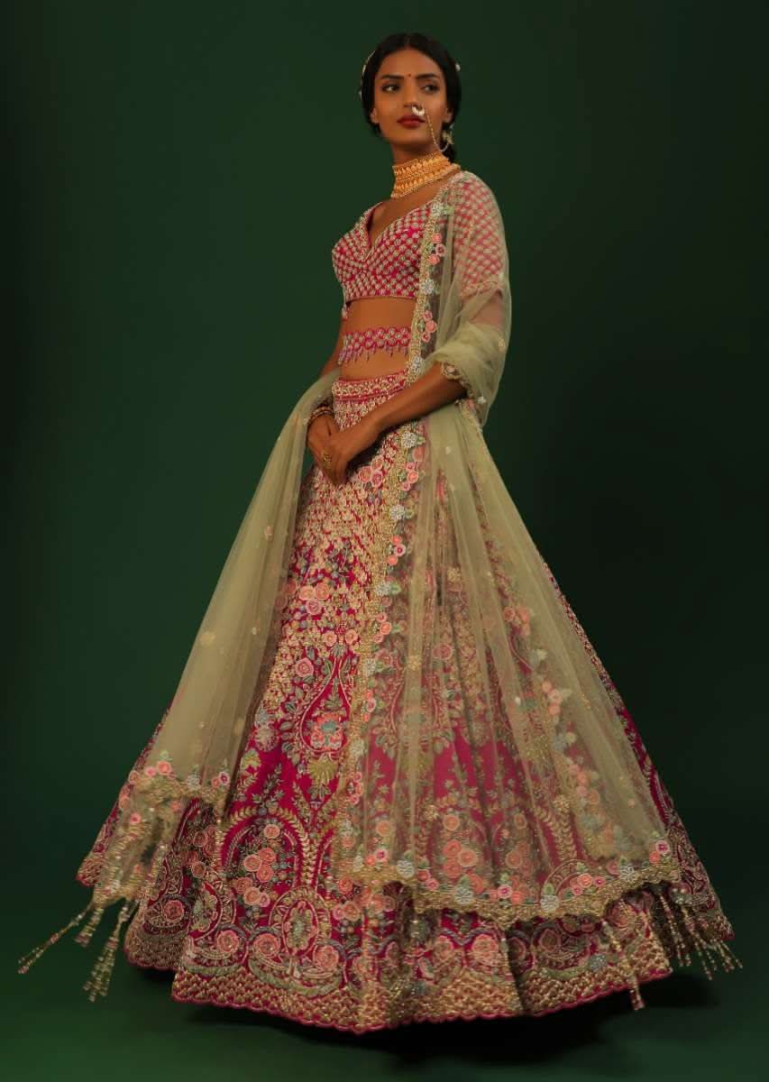 Rani Pink Lehenga Choli In Raw Silk With Heavy Embroidered Kalis Using Colorful Resham And Cut Dana In Floral Motifs Online - Kalki Fashion - Image 3
