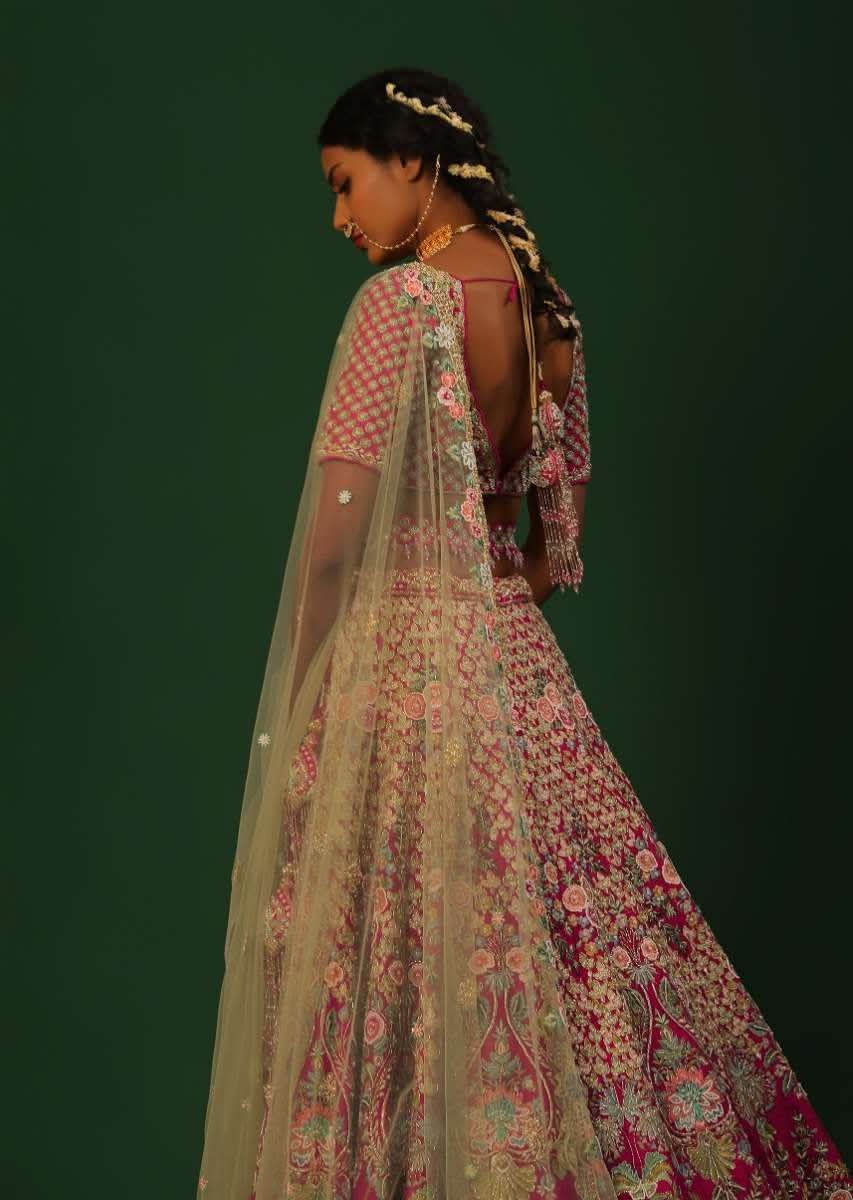 Rani Pink Lehenga Choli In Raw Silk With Heavy Embroidered Kalis Using Colorful Resham And Cut Dana In Floral Motifs Online - Kalki Fashion - Image 4