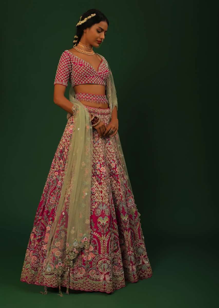 Rani Pink Lehenga Choli In Raw Silk With Heavy Embroidered Kalis Using Colorful Resham And Cut Dana In Floral Motifs Online - Kalki Fashion - Image 5