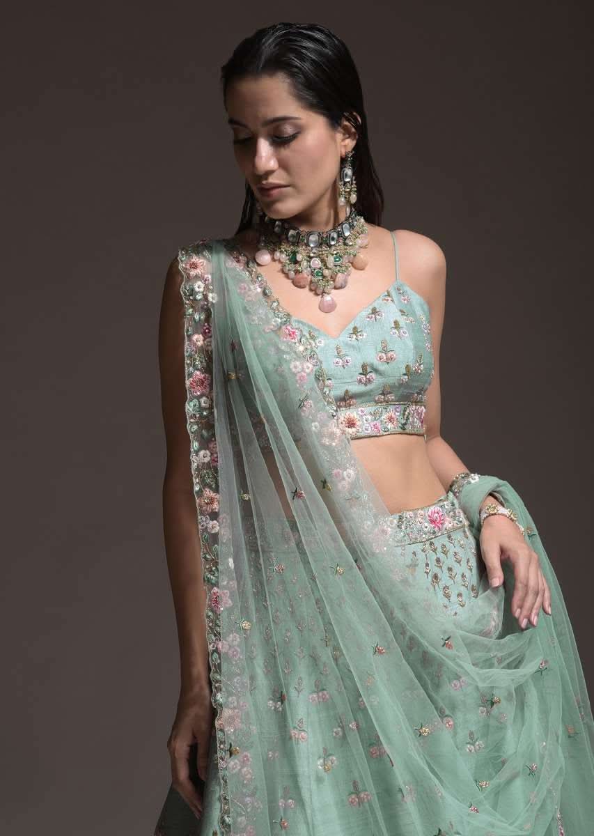 Sage Green Lehenga Choli In Raw Silk With Vibrant Resham Embroidered Cluster Of Summer Blooms And Buttis - Image 12